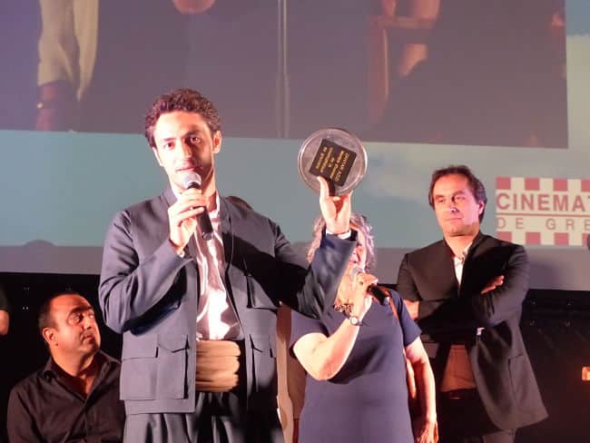 De gauche à droite : le réalisateur Berni Goldblat, Zanyar Azizi, sa traductrice et Nicolas Tixier, président de la Cinémathèque de Grenoble. © Alexandra Moullec