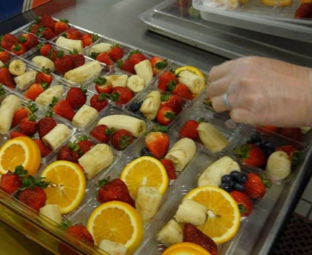 Fruits in plastic trays on table in Whitley County School District, KY. © US Department of Agriculture