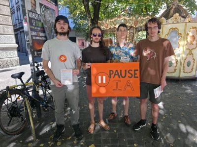 Des bénévoles de l'association Pause IA ont mené une action de sensibilisation contre les risques de débordement des intelligences artificielles. © Joël Kermabon - Place Gre'net